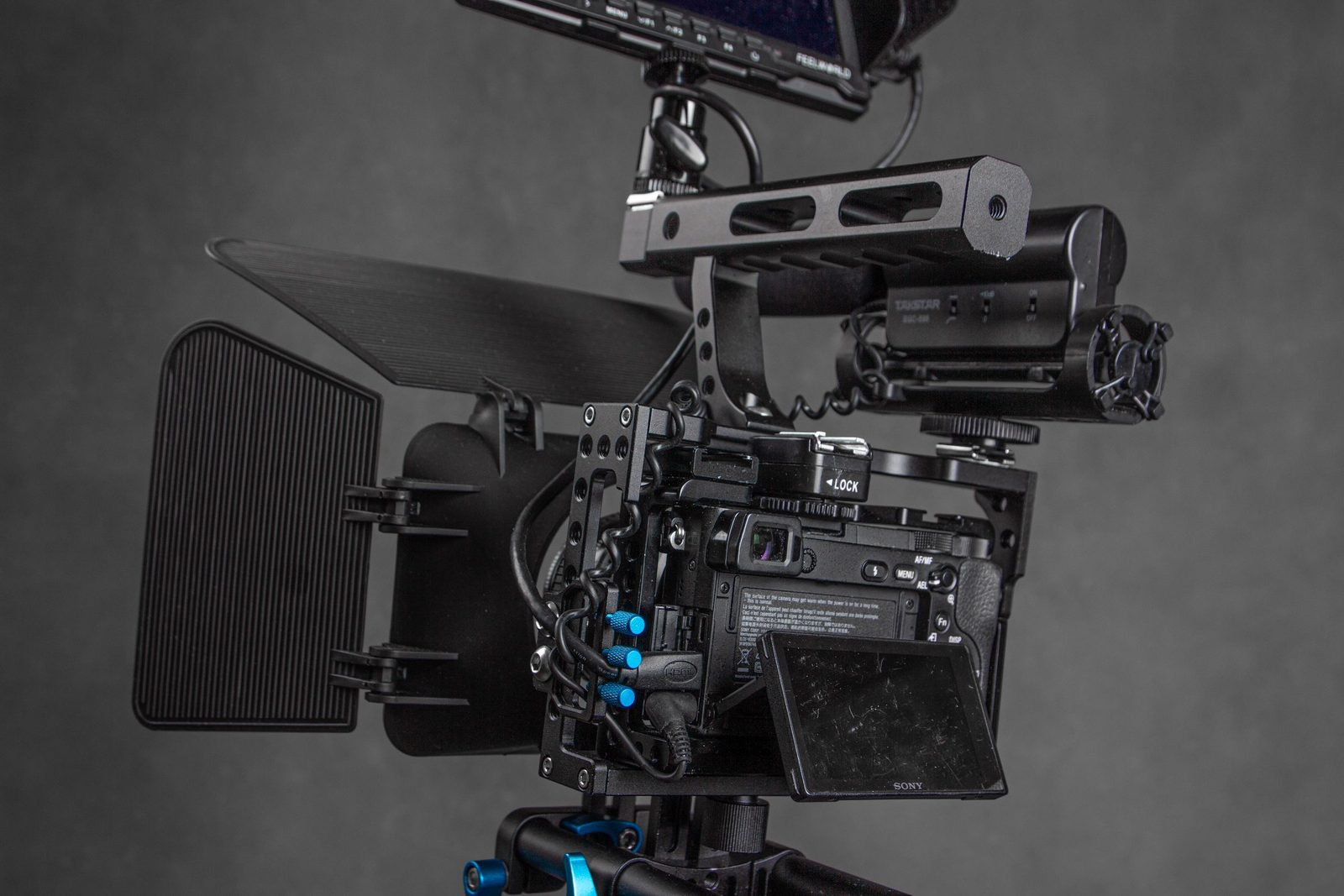 Camera rig with cage, handles and monitor